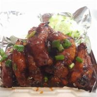 Chicken Wings · Brined, smoked, fried & then bathed in our wing sauce. Served with your choice of ranch or b...