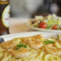 Fettuccine Shrimp Alfredo · Sauteed shrimp and fettuccine noodles served in our homemade Alfredo sauce made from cream, ...