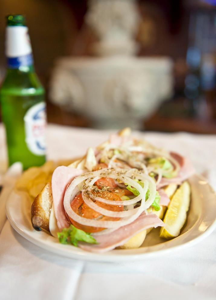 Ham and Cheese Sub · Served with a pickle spear side. Served with lettuce, onions, tomatoes, oregano, and house Italian dressing.