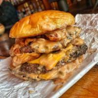 Zaza Burger  · BACK BY POPULAR DEMAND!!

Double stack beef hamburger with homemade Mac sauce, bacon on a br...