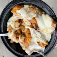 DEVOURING DISCO  ·  waffle fries in a gravy sauce topped with mozzarella and chopped buttermilk fried chicken 