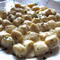 Gnocchi al Gorgonzola · Potatoes, ricotta, gorgonzola and dolce cheese sauce.