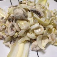 Bianca Salad · Endive, artichokes, hearts of palm, white mushrooms, shaved Parmesan cheese and champagne vi...