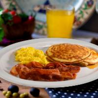 Breakfast · Scrambled eggs, pancakes, and bacon.