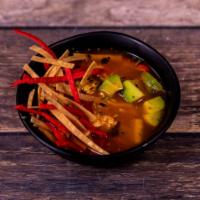 Tortilla Soup · Light chicken broth with shredded chicken, diced tomatoes, corn and cheese. Topped with tort...
