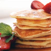 4 Pancakes · Dusted with powdered sugar, served with butter and warm syrup.
