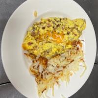 Meat Lover’s Omelette · A meat lover’s dream of diced ham off the bone, bacon, and sausage with cheddar and mozzarel...