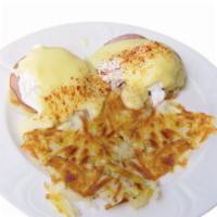 The Traditional Bennie · 2 poached eggs and Canadian bacon served atop an English muffin, lavished with our rich home...