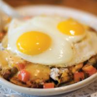 Spicy Flamenco Skillet · A South of the border treat. Eggs, chorizo, jalapenos, onions, and melted cheddar cheese wil...
