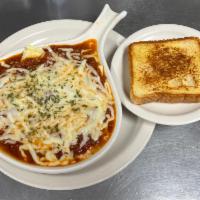 Cheese Manicotti Parmesan · 3 of our savory Italian manicotti baked in a casserole and topped with homemade meat sauce a...