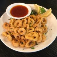 Calamari · Fried calamari rings, fried banana peppers, sweet chili garlic sauce.