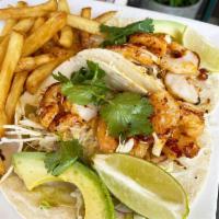 Fish or Shrimp Tacos (2) · Fish or shrimp. Seasoned cod, cabbage salad, cilantro, avocado, spicy serrano pepper sauce.