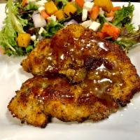 Chicken Capricosa · Breaded chicken served with mixed greens, cherry tomatoes, red onion, fresh mozzarella and p...