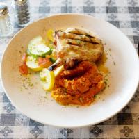 Pork Chop · Grilled and topped with an apricot cream sauce. Served with mashed sweet potatoes and vegeta...