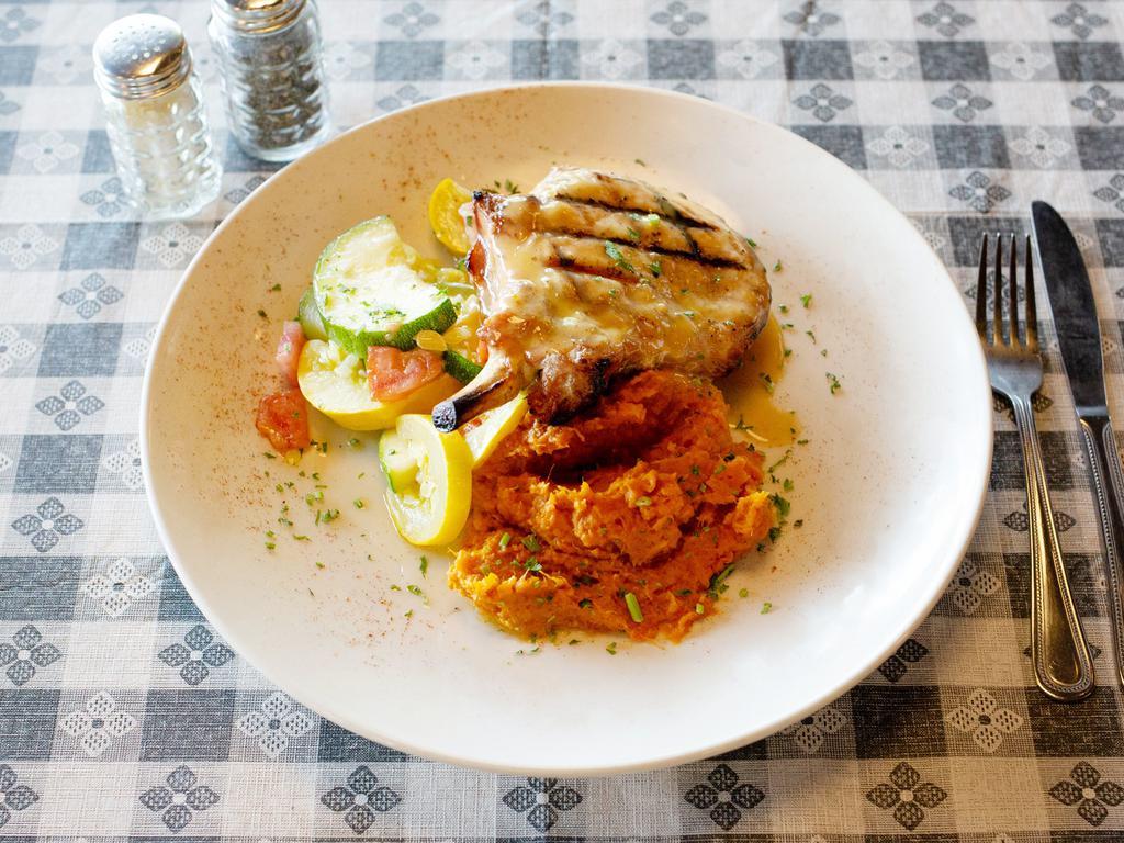 Pork Chop · Grilled and topped with an apricot cream sauce. Served with mashed sweet potatoes and vegetable of the day.