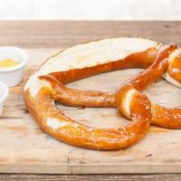 Riesenbrezel · Giant warm German soft pretzel, shaved salt & mustard.