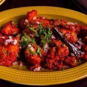 Murgh 65 · Chicken fried with rice and cornflour, sauteed in red chili-yogurt marinate, curry leaves, a...