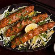 Kakori Kebab · Minced lamb skewered and roasted in tandoor oven served with onions, lemons and chutneys