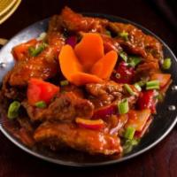 Chili Fish (Dry) · Fish sauteed with bell peppers, green chilies, and onions in a soy-ginger flavor