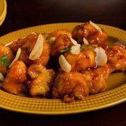 Jashan Lasoni Gobi · Battered cauliflower sauteed in a tangy sauce with garlic, onions, and bell peppers