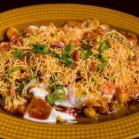 Aloo Tikki Chaat · Spiced potato patties, chickpeas, yogurt, and chutnies