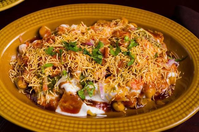 Aloo Tikki Chaat · Spiced potato patties, chickpeas, yogurt, and chutnies
