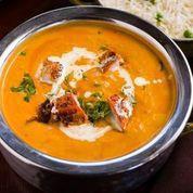 Murgh Tikka Masala · Chicken tikka pieces in creamy tomato sauce topped with dried fenugreek leaves and milk cream.
