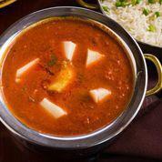 Murgh Vindaloo · A very hot chicken curry cooked with red chilies, vinegar, potatoes.