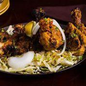 Murgh Chop · Bone-in chicken marinated in cumin-coriander marinade, roasted in a tandoor oven, and served...