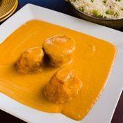 Dum Aloo · Potatoes stuffed with nuts and curried in Kashmiri style creamy tomato sauce