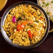 Paneer Khurchan · Grated paneer cheese curry prepared with onions and tomatoes and topped with chopped thin tomatoes