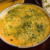 Mutter Paneer · Cheese and green peas, creamy tomato sauce.