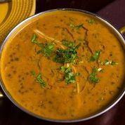 Daal Makhani · Balck creamy Lentils, slow-cooked in medium heat and topped with cilantro and ginger