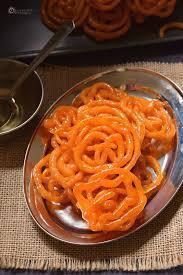 Jalebi · Deep frying flour batters in a pretzel shape and soaked in sugar syrup.