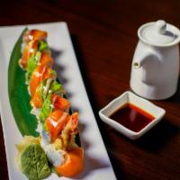 Lobster Bomb Roll · Tempura lobster and asparagus topped smoked salmon and avocado along with spicy cream sauce.