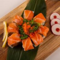 Orange Blossom Roll · Spicy salmon, cucumber topped with salmon, seaweed salad and masago.