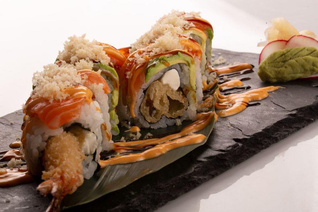 Super Crunch · Shrimp tempura and cream cheese topped with salmon, avocado and crunch flakes spicy mayo and eel sauce.