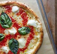 Marinara Pizza · San Marzano, garlic, origano, romano, white anchovy.
(no cheese)