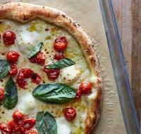 Pomodorini Pizza · Fresh cherry vesuvian tomato, bufala, garlic, basil.