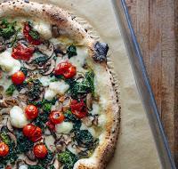 Verdura Pizza · Broccoli rabe, mushroom, pomodorini, garlic.