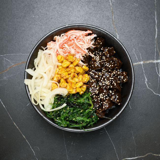 BEEFY Bowl · Teriyaki Beef, Kani Salad, Seaweed Salad, Sweet Corn, Shoyu Onion, Sesame Seeds topped with Teriyaki