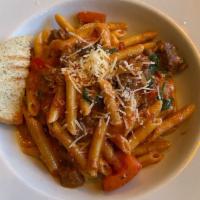 Penne al Diavolo Rustico Lunch · Home style beef sausage, plum tomatoes, sauteed spinach, and tomato-cream sauce.