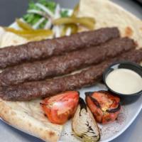 Iraqi Style Kabob · 3 Ground beef Kabob/ Grilled Tomato and Onions/Bread and Salad with our special sauce.