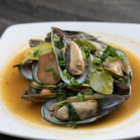 Steamed Mussels · Thai style steamed mussels in Thai herbs.