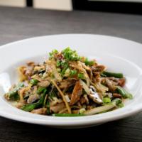 Duck Ga Prow · Crispy roast duck with bell pepper, green bean and onions in basil sauce.