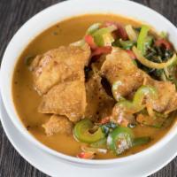 Fish Chu Chee · Crispy fish fillet with bell pepper, onions and Thai basil in red curry sauce.