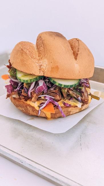 LUCILLE. · Lemongrass Braised Pork, Cucumber, Escabeche (Pickled Carrot And Jalapeno), White Onion, Aioli, Sriracha, Ginger Chimichurri, And Red Cabbage Salad
