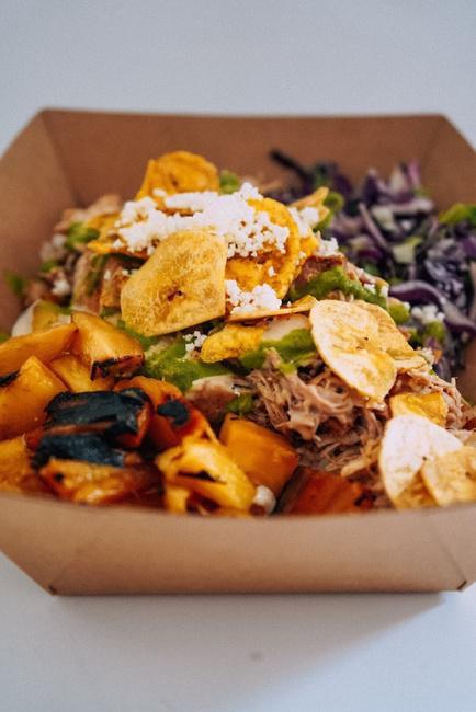 DEVILLE BOWL · Braised Chicken, Plantain Chips, Grilled Pineapple, Adp Queso, Ginger Chimichurri, Queso Fresco, And Red Cabbage Salad
