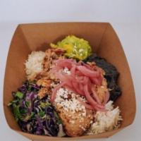 BRAISED CHICKEN BOWL · Refried Black Beans, Smashed Avocado, Red Cabbage Salad, Pickled Onion, And Queso Fresco.