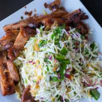 Chicken Cabbage Salad · Grille Chicken, mixed cabbage, fried shallots, and cilantro tossed in a lime vinaigrette dre...
